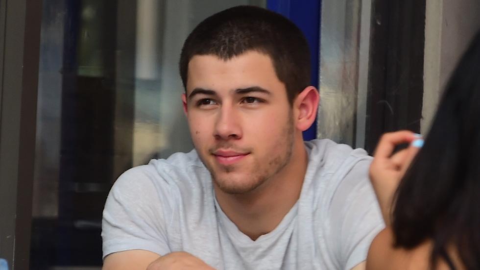 Nick Jonas looks glum as he eats lunch in the West Village