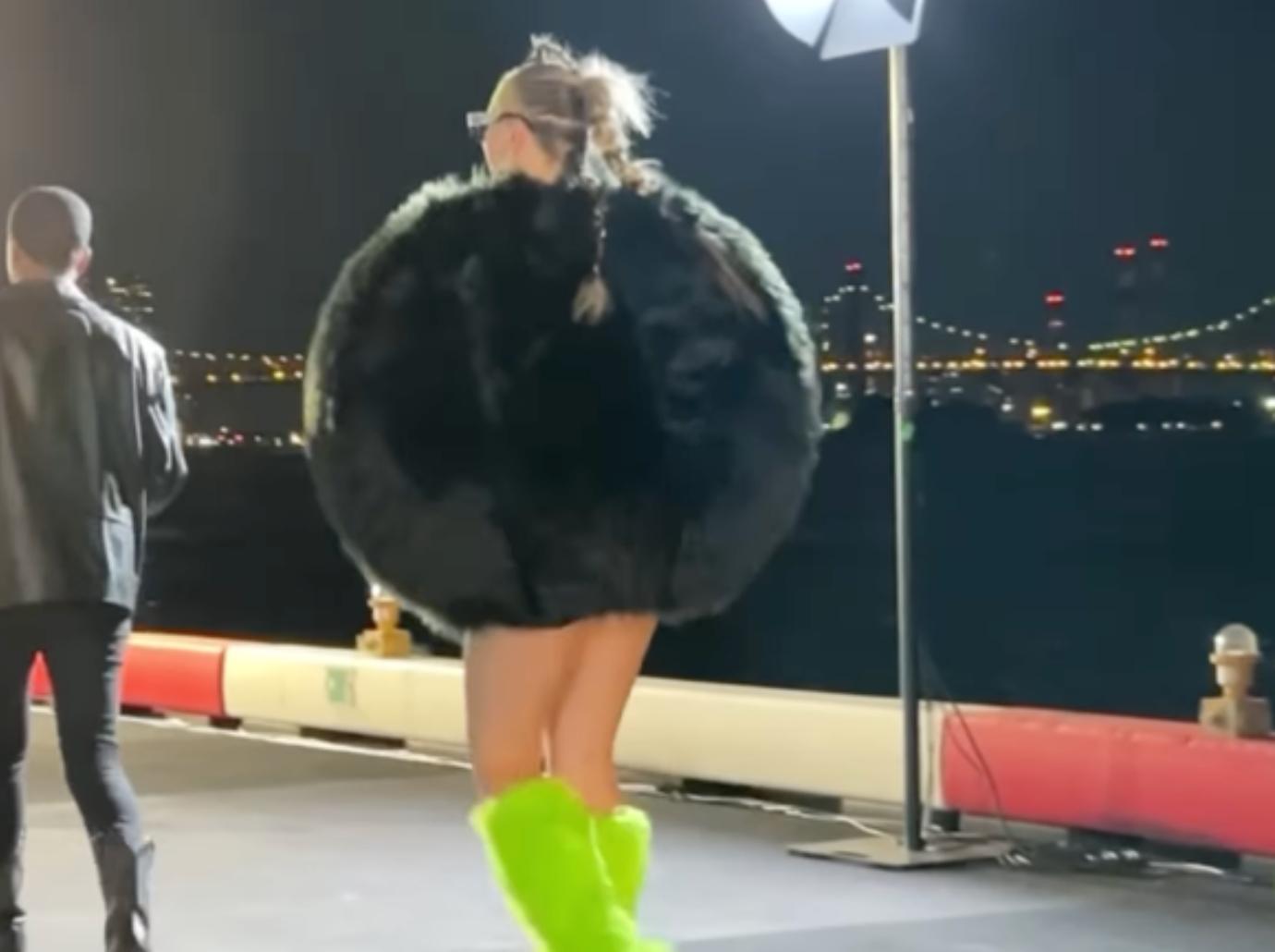 jojo siwa nyc fashion week outfit furry black ball green boots photos