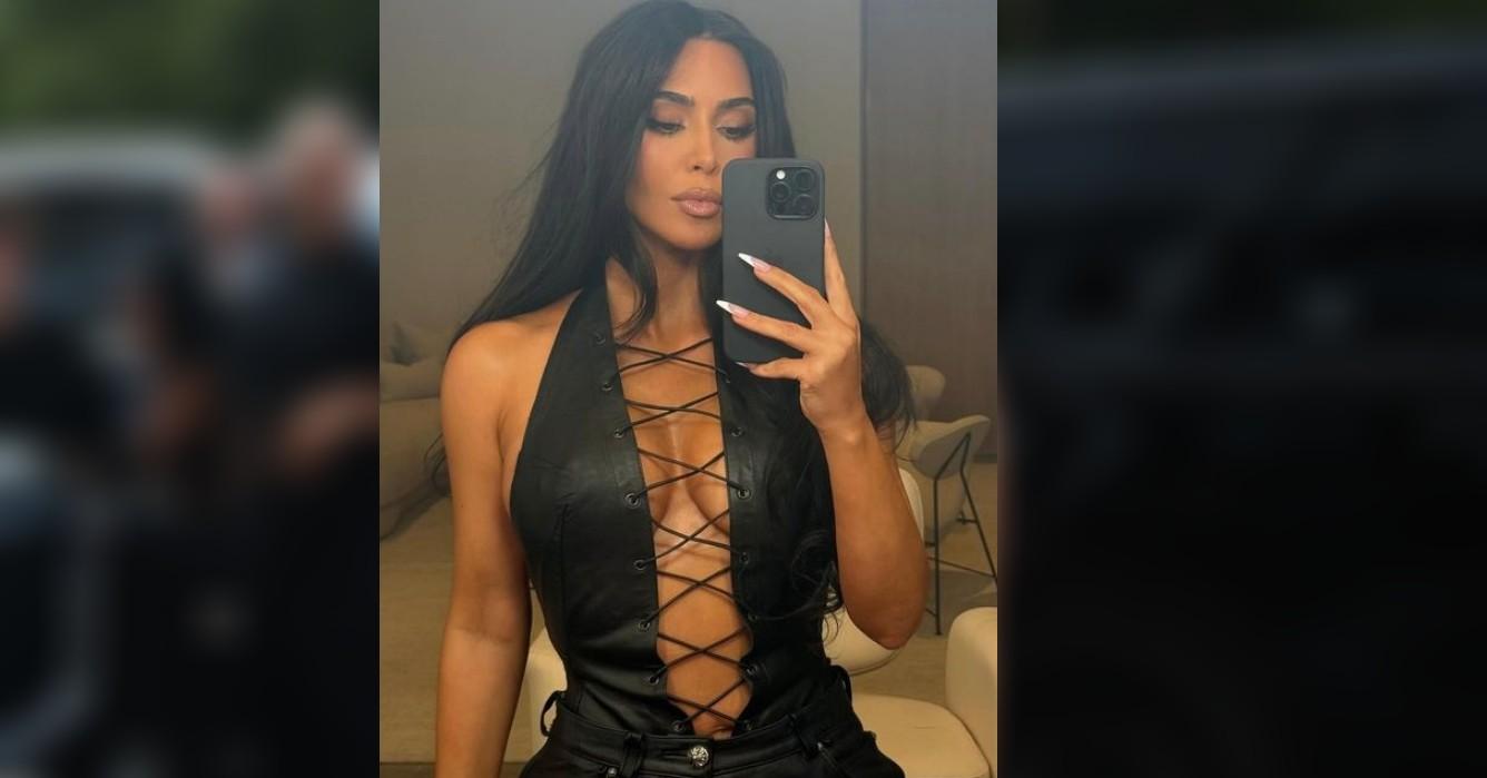 kim kardashian shows off ample assets risque leather corset photos