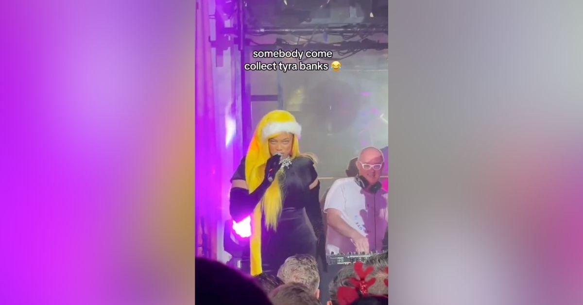 Image of Tyra Banks dressed up in a yellow wig and Santa hat.