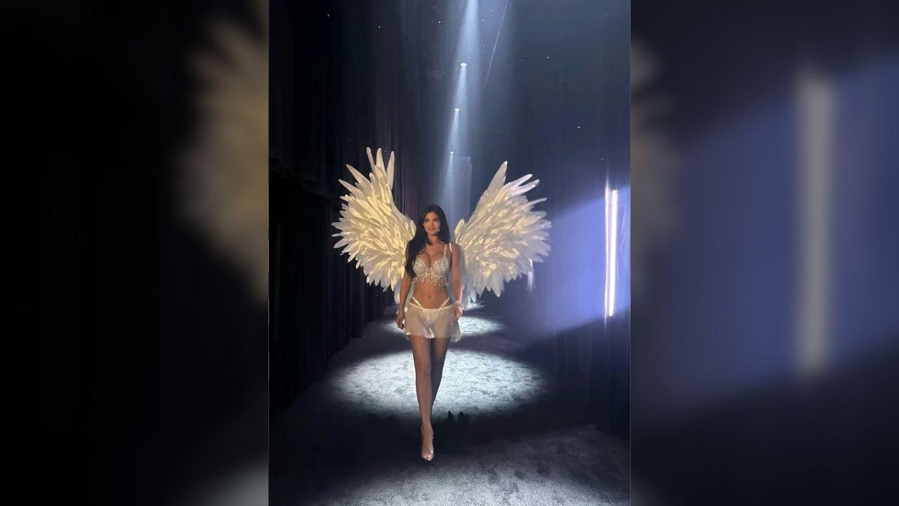 image of Jenner shared backstage footage of her children, Stormi, 8, and Aire, 4, watching her runway debut as she waved to them in her diamond-studded outfit.