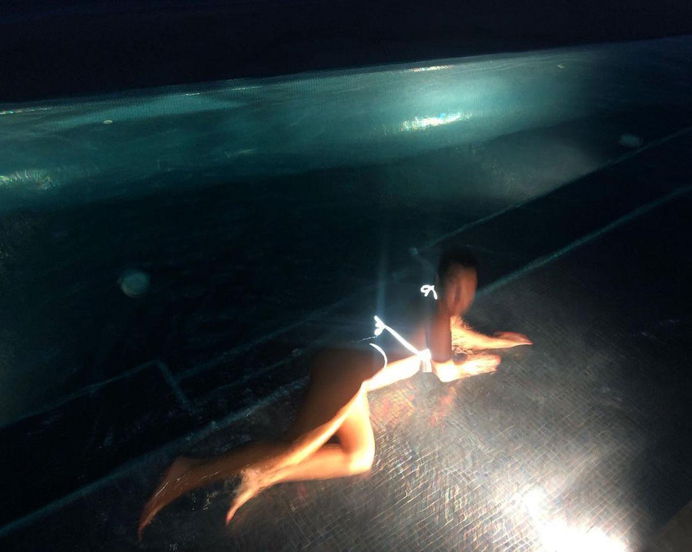 kourtney kardashian wears glowing bikini