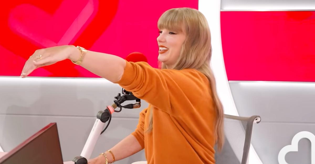 Photo of Taylor Swift showed off her engagement ring, noting she told Travis Kelce about the designer over a year ago.