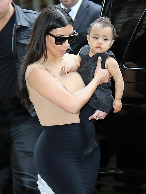 Kim Kardashian goes for a walk with her baby daughter North West