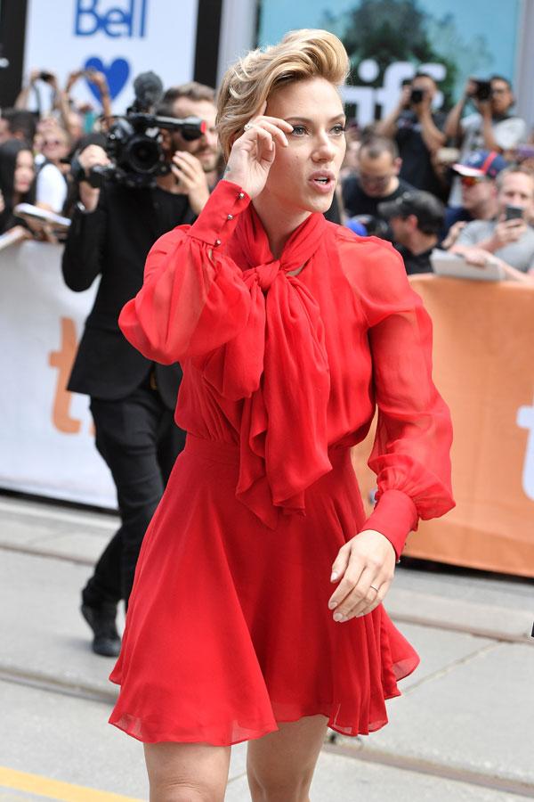 Scarlett Johansson's ample assets spill out of boob-baring dress