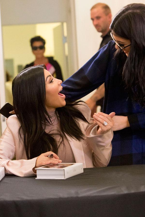 Kardashians dash signing