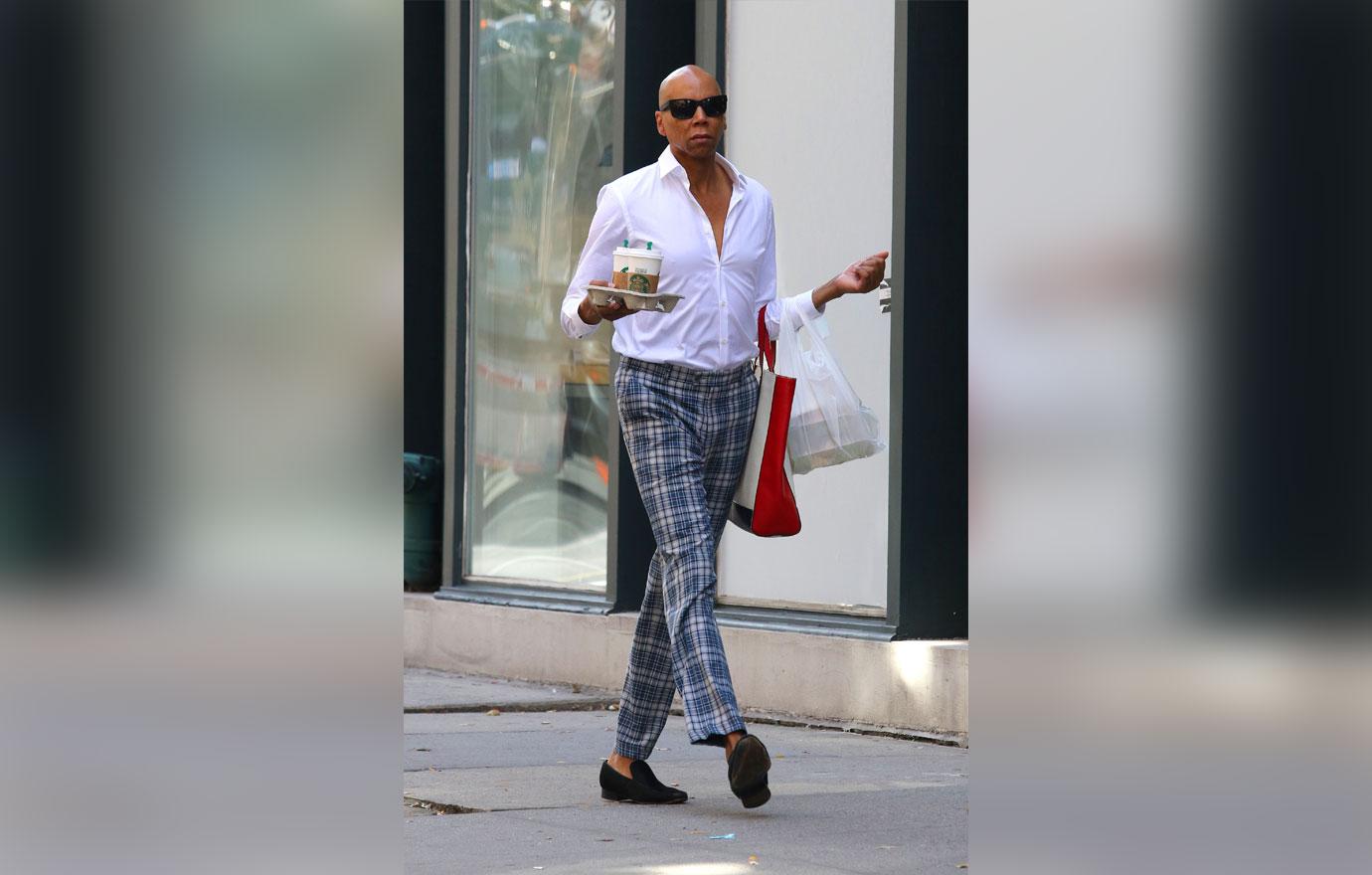 RuPaul walks the streets of Manhattan like its a runway while multitasking in NYC