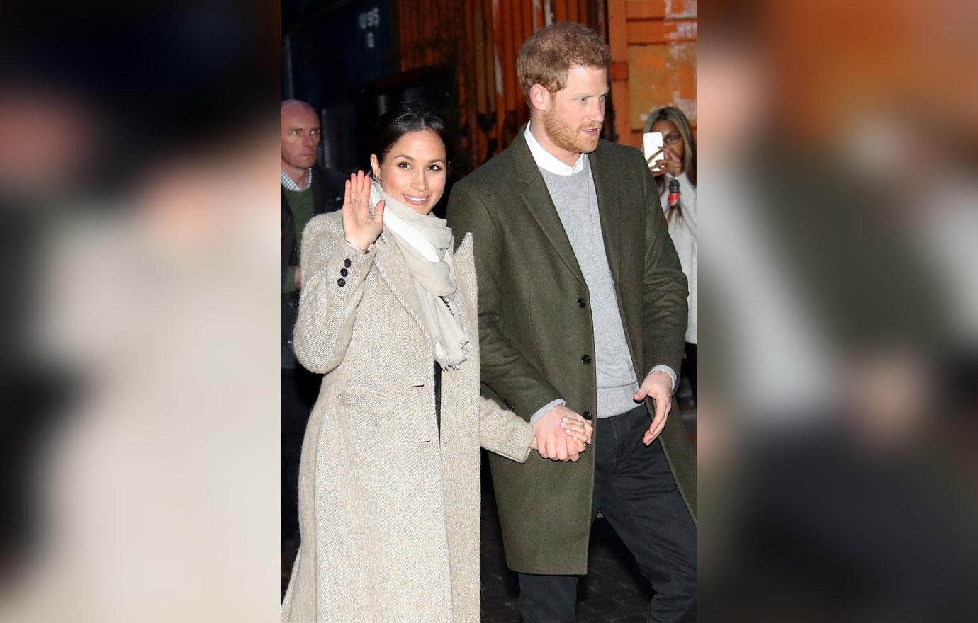 Prince Harry and fiancée Meghan Markle wave to fans leaving Reprezent 107.3FM in Brixton