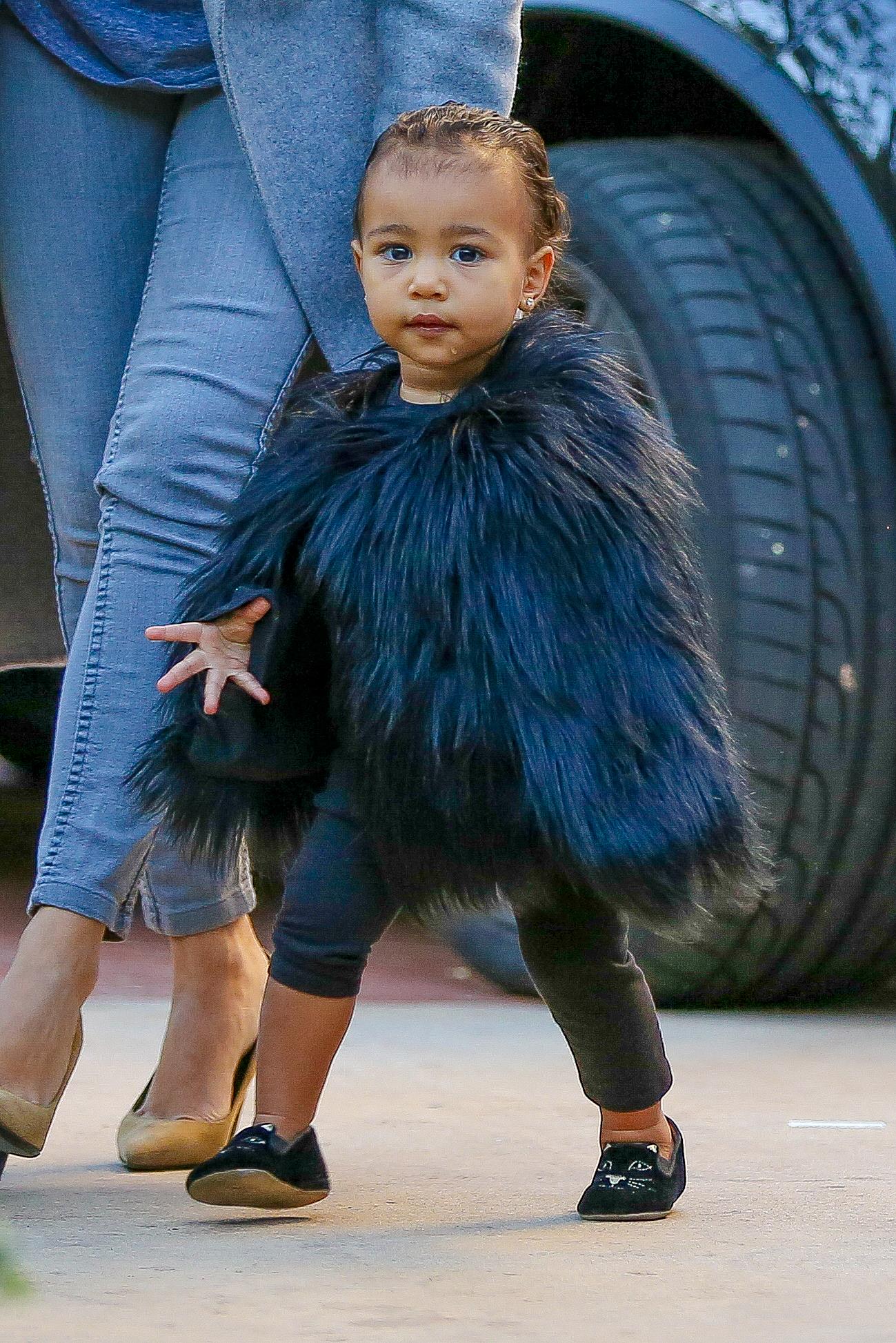 Little Nori North West rocks a black fur for a play date