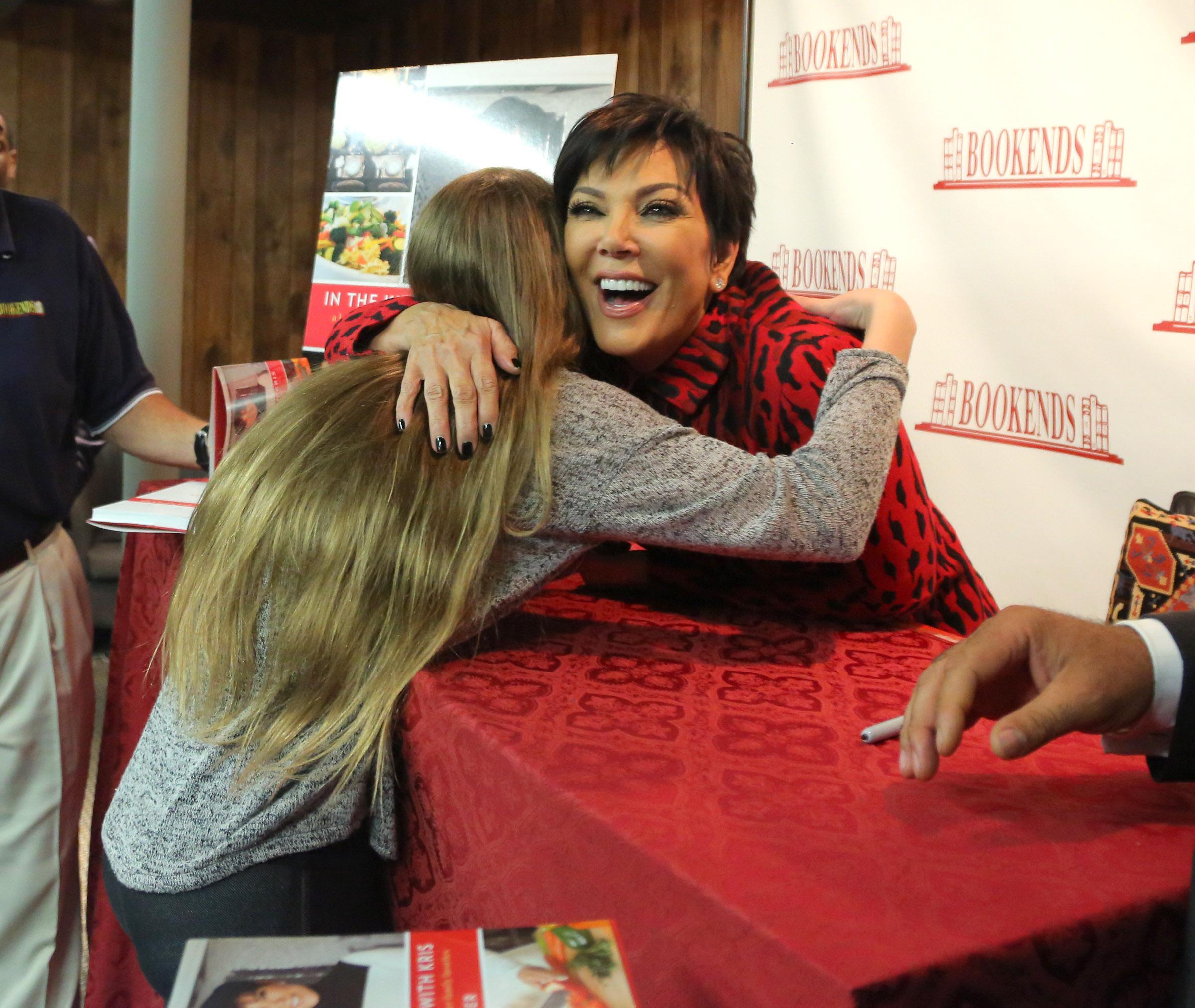 Kris Jenner has her first book signing for her new cookbook as fans pose and take selfies with her in NJ