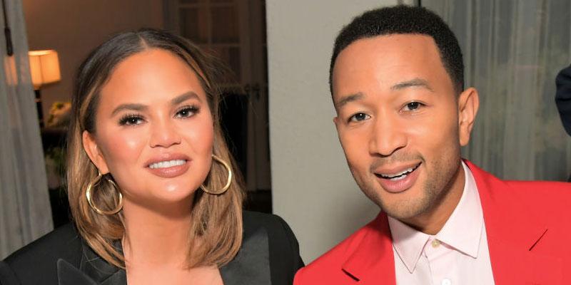 Chrissy Teigen And John Legend Pose At An Event