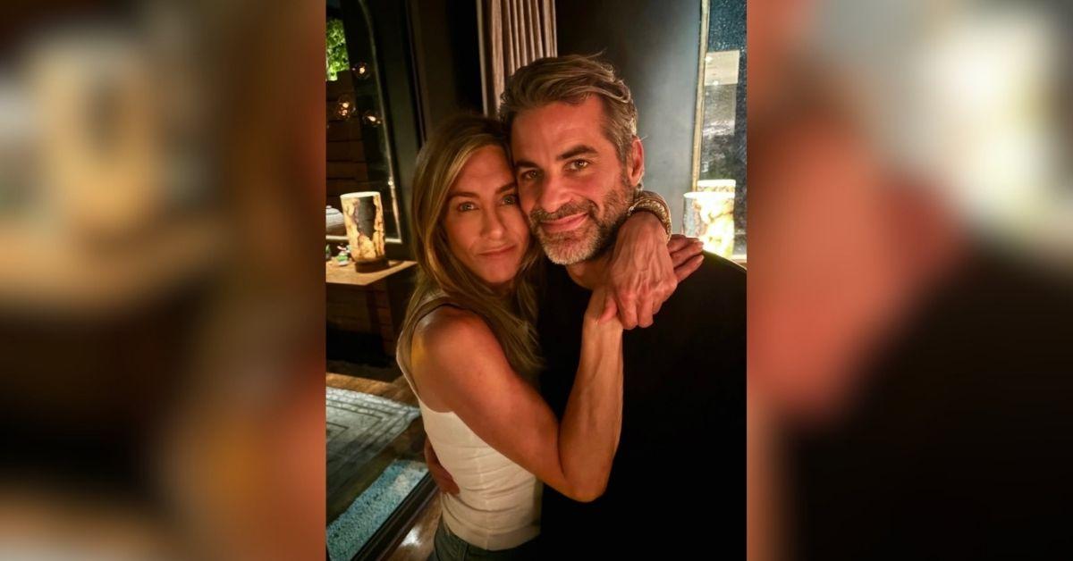 image of Jennifer Aniston wrapped her arm around Jim Curtis in a new photo. 