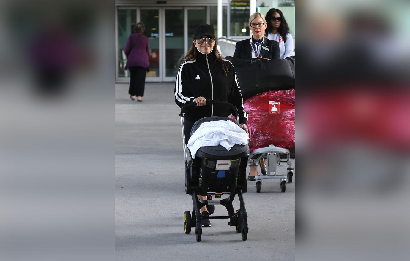 EXCLUSIVE: Eva Longoria arrives back in Australia with baby Santiago