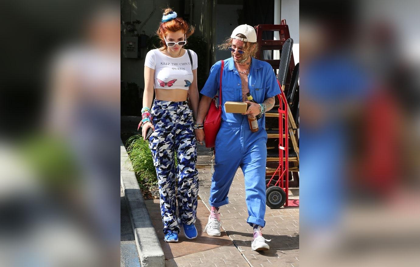 Bella Thorne Mod Sun Holding Hands