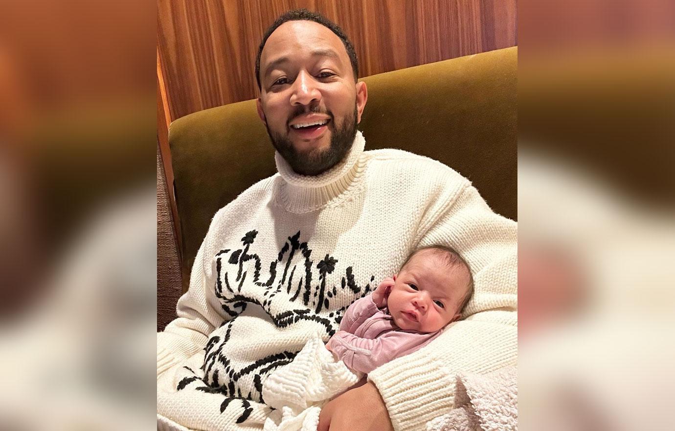 john legend all smiles holding baby girl esti