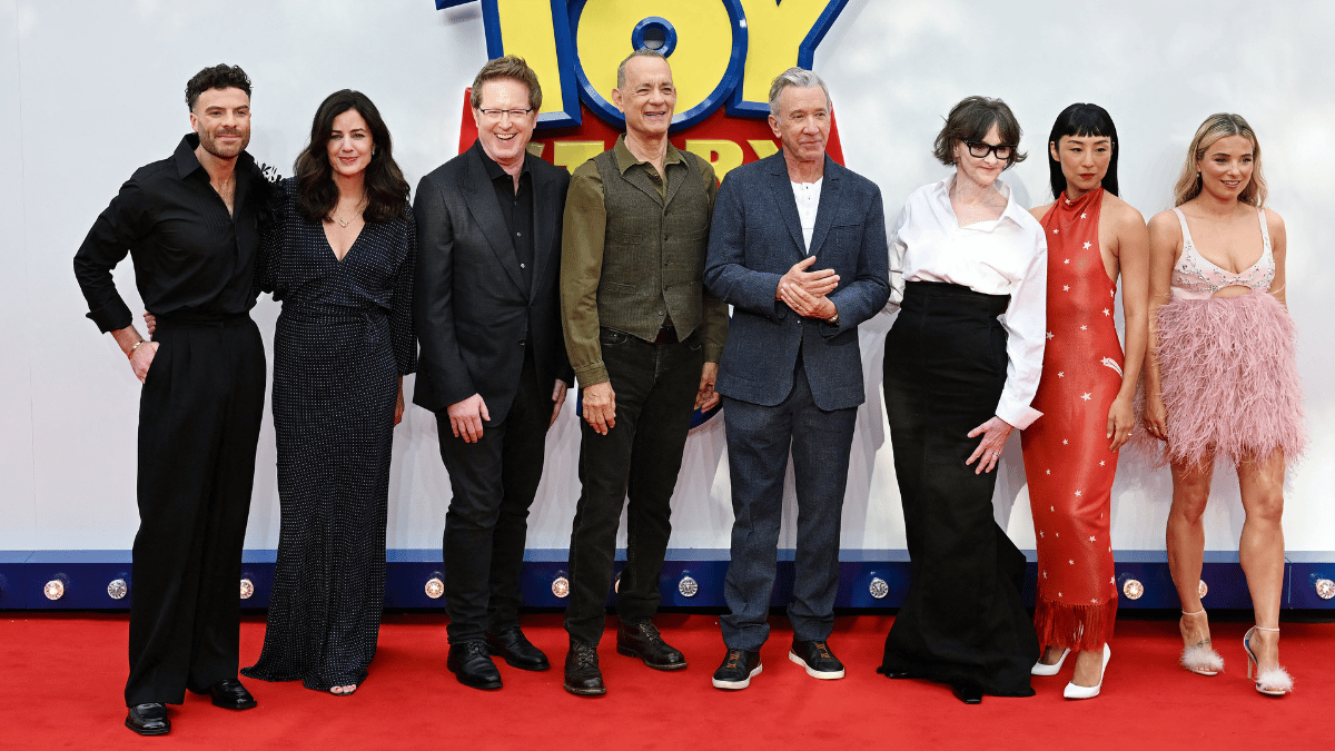 Photo of Tom Hanks and Tim Allen, center, with the 'Toy Story 5' team