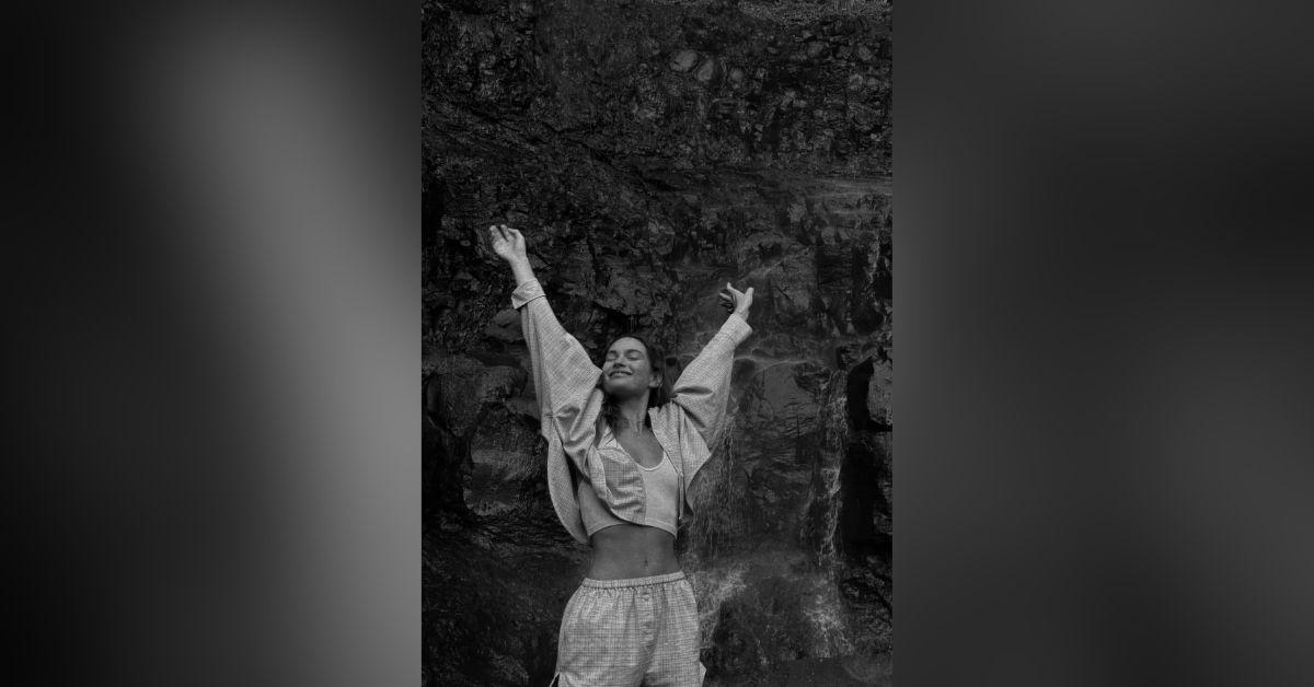 Image of Lily James was all smiles at a local waterfall.