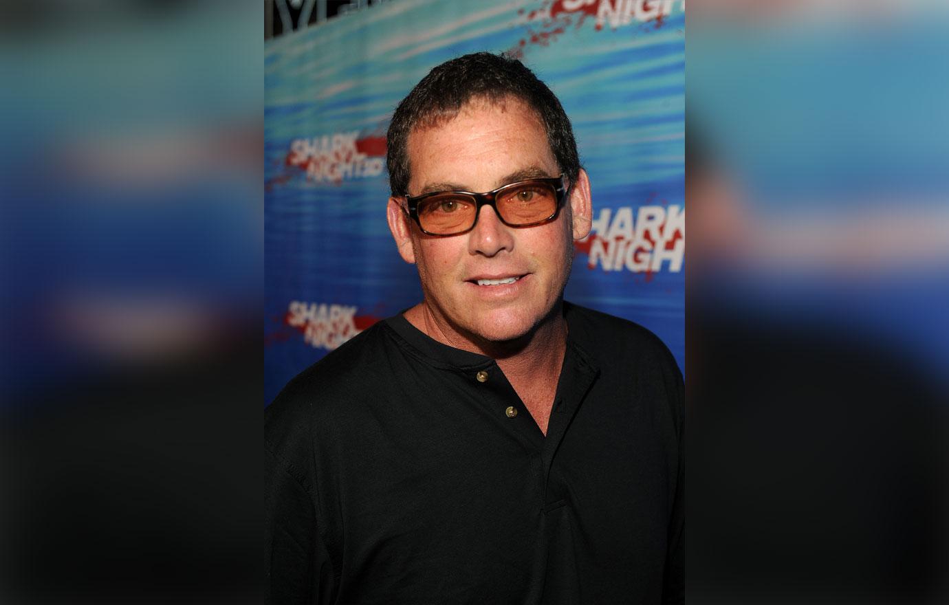 Mike Fleiss Sunglasses And Black Shirt