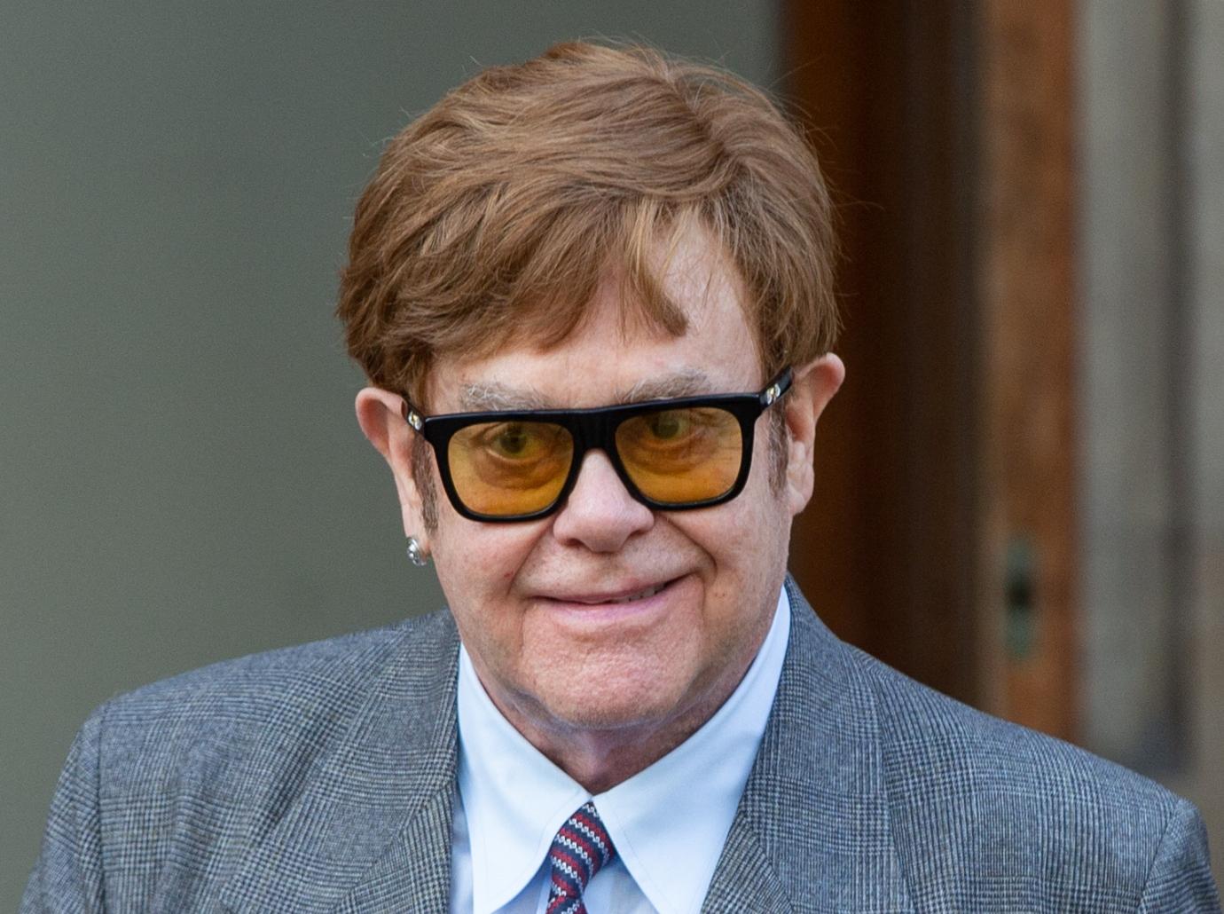 elton john sparks health concerns cane injured foot photos