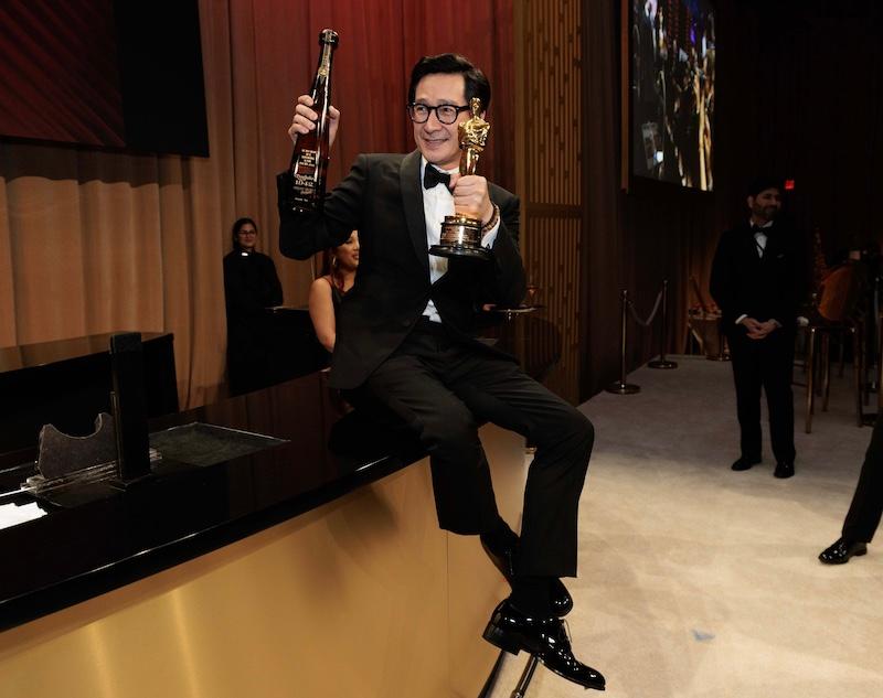 ke huy quan celebrates with tequila don julio  as he gets his oscar engraved at the governors ball after the ceremony