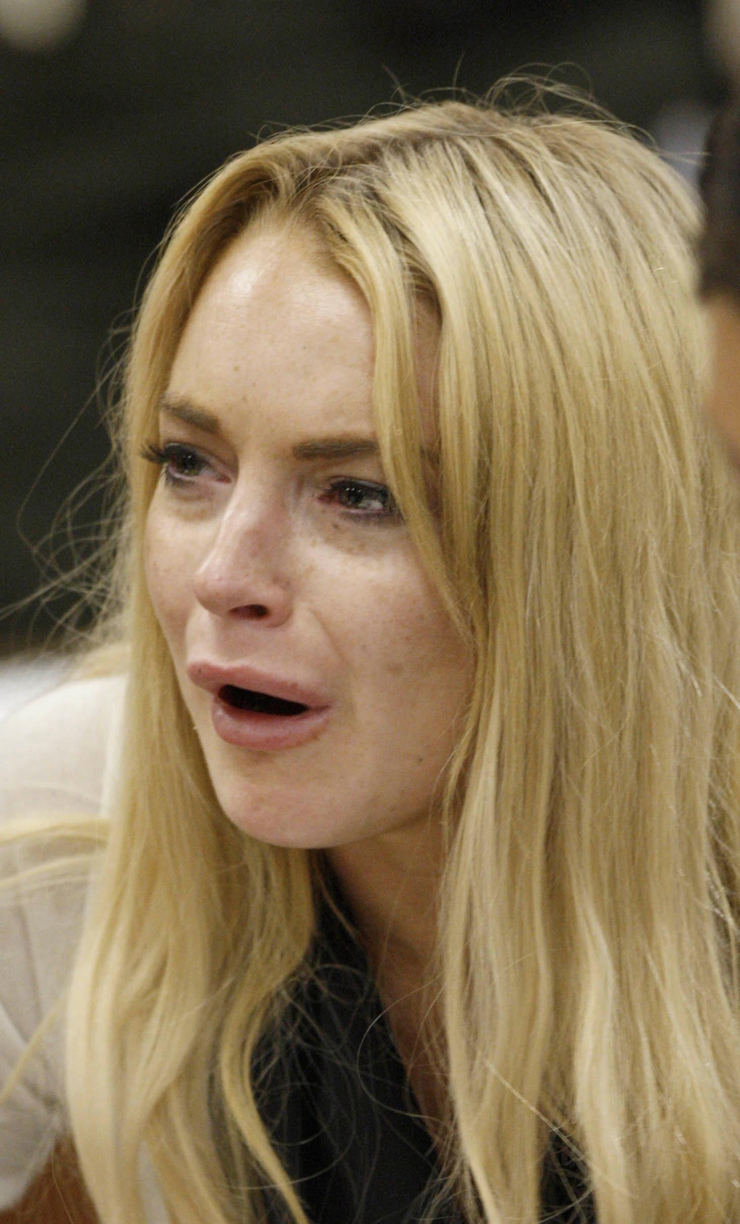 Lindsay Lohan cries in court after being sentenced to 90 days in jail for violating her probation