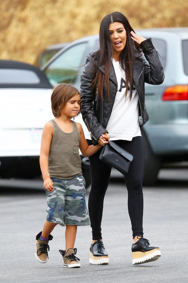 Kourtney Kardashian and little Mason get to work