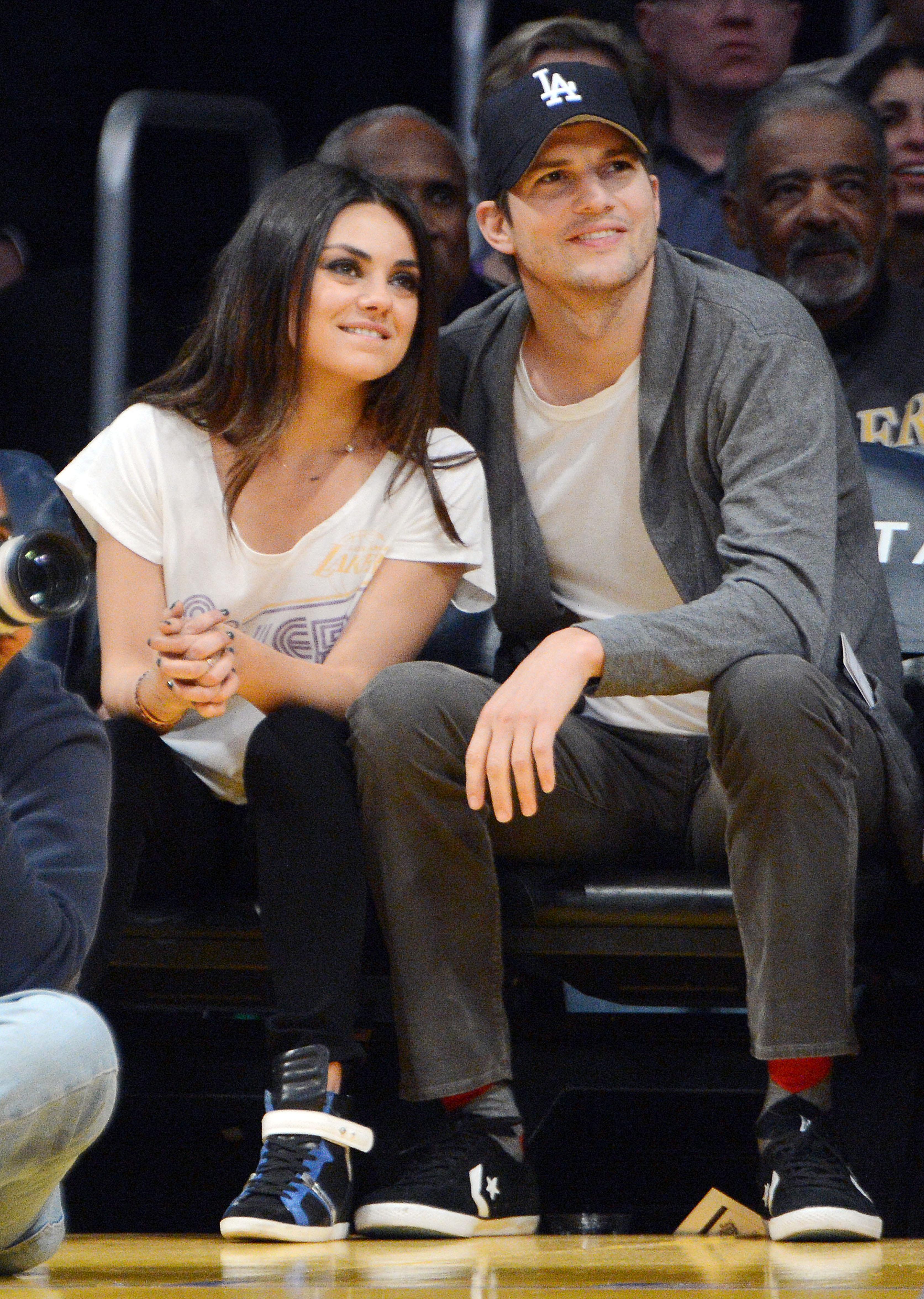 Ashton Kutcher and Mila Kunis watch Lakers play Suns, Los Angeles, CA