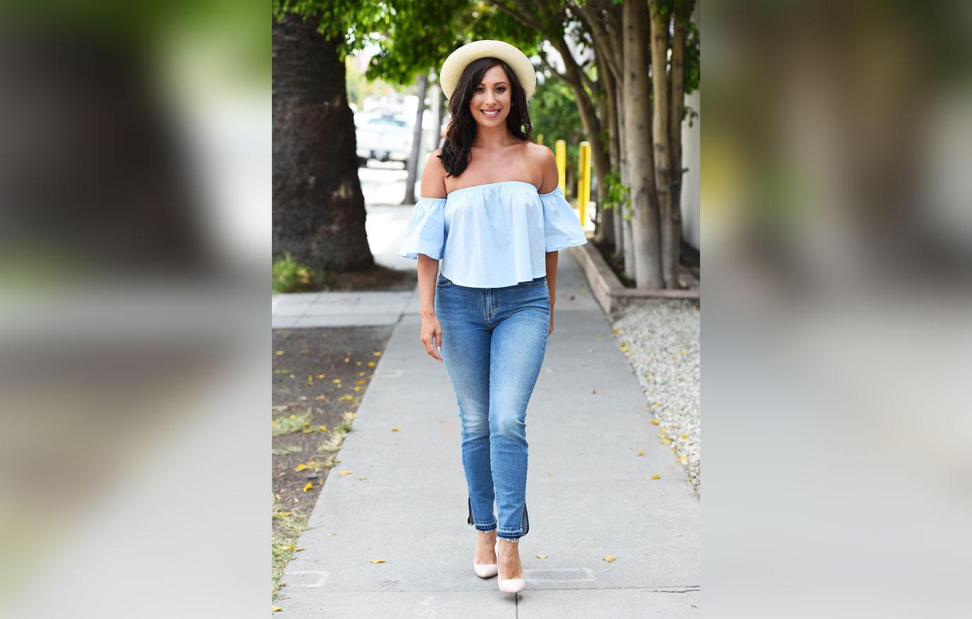 Cheryl Burke Wears a Blue Peasant Blouse and Straw Hat