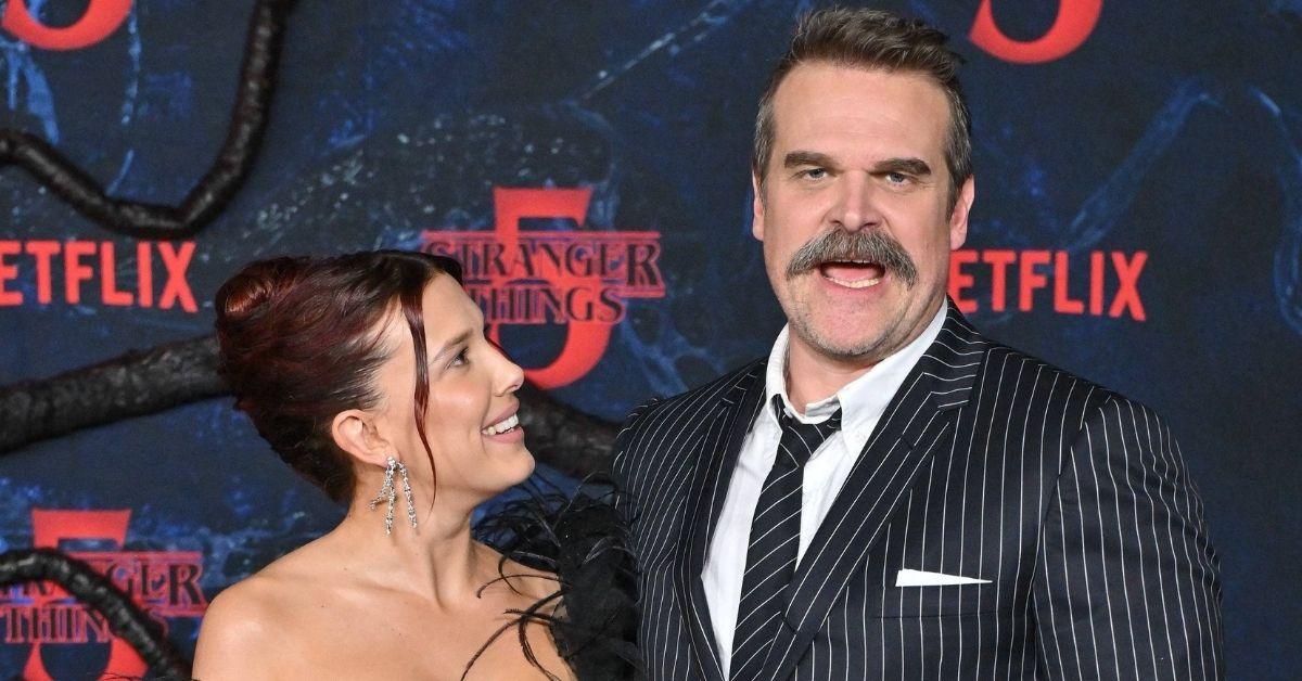 image of Millie Bobby Brown wowed in a black lace gown, while David Harbour kept it classic in a navy pinstripe suit.
