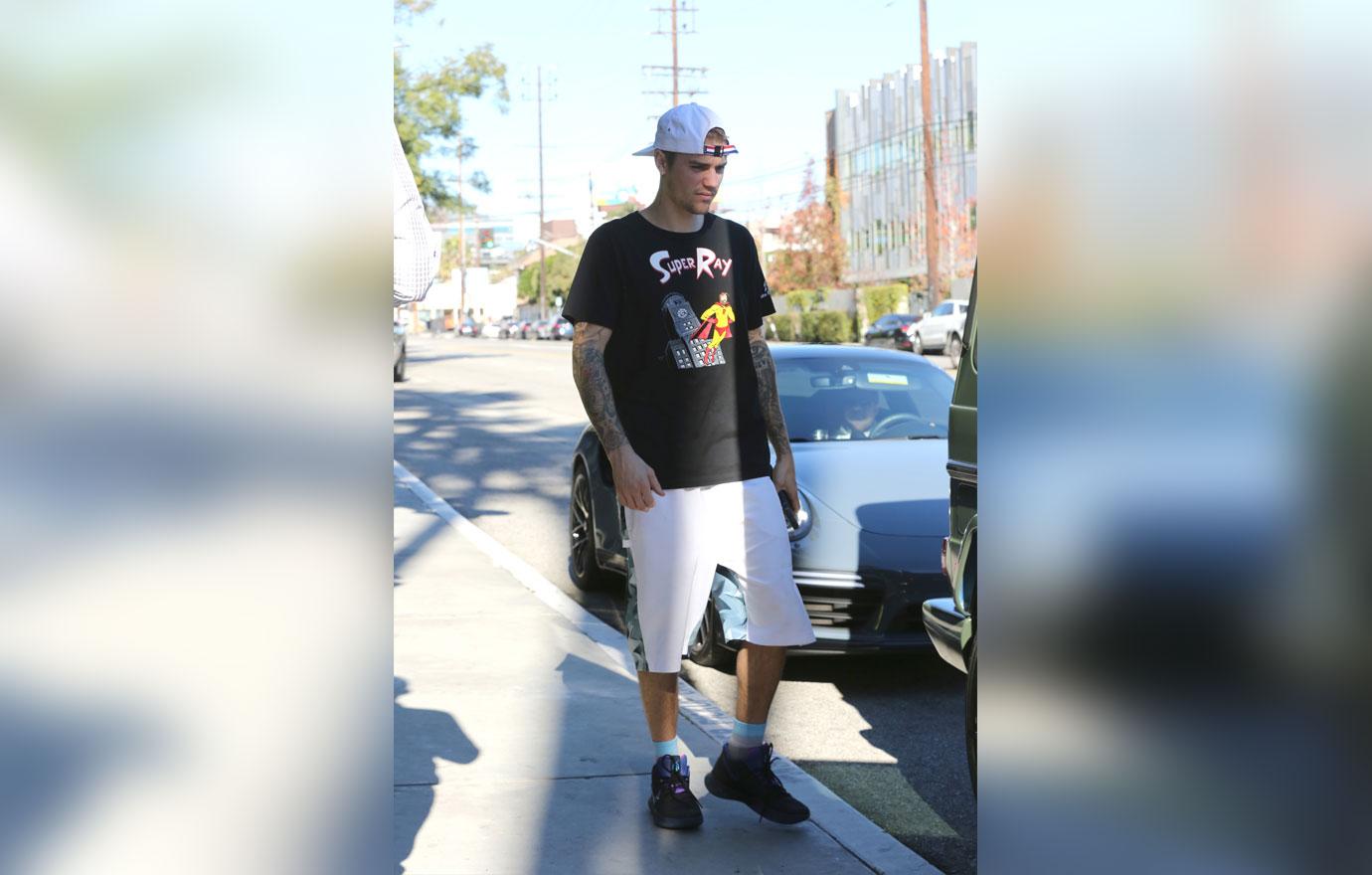 Justin Bieber is all smiles as he leaves the gym