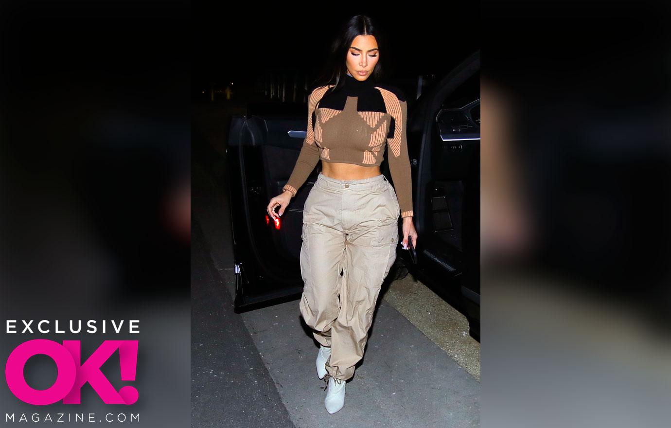 Kim Kardashian rocks a skin-tight tank top and stone-washed cargo pants  while out with