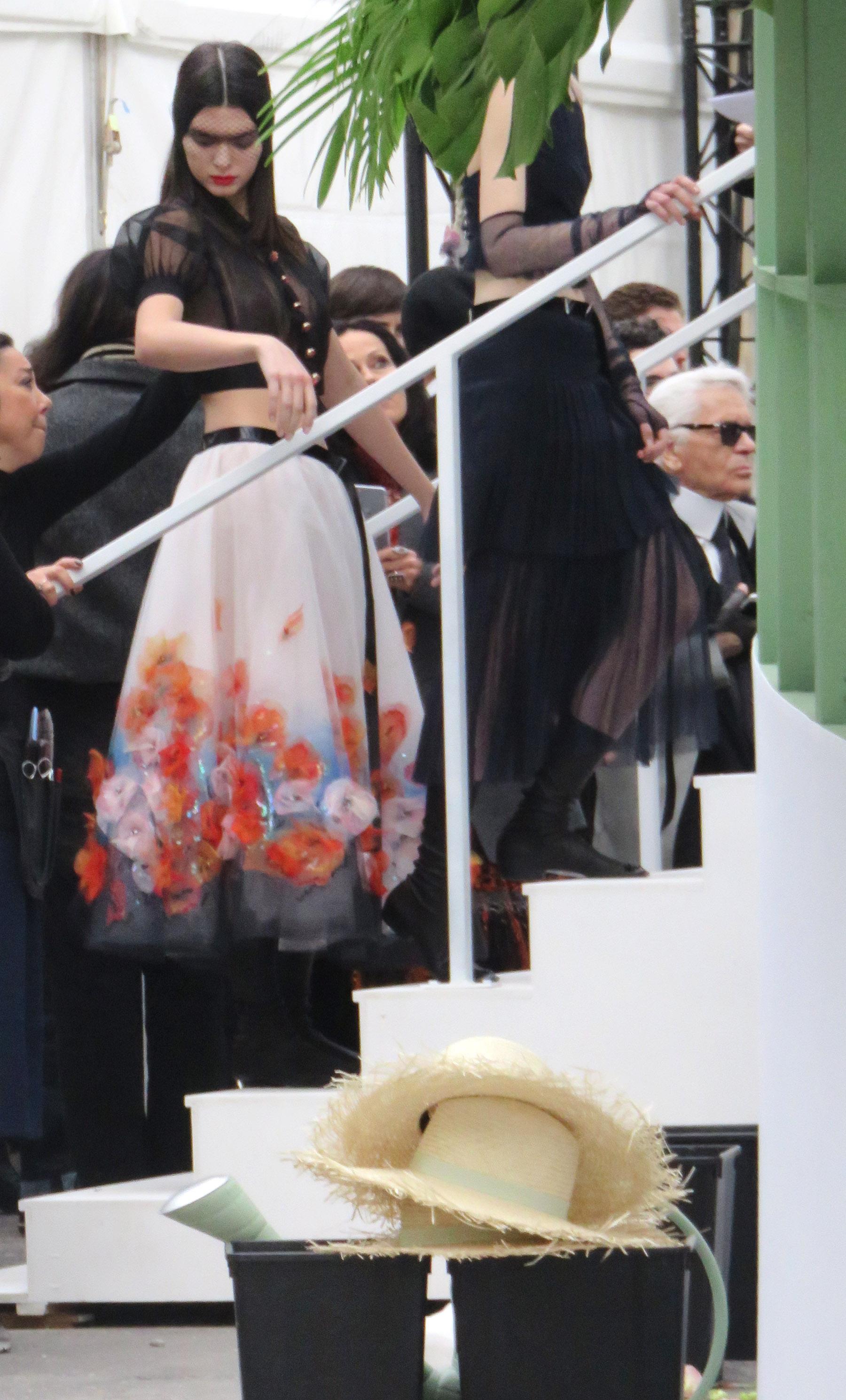 Kendall Jenner backstage with Karl Lagerfeld at Paris Channel show, later all smiles after her big fashion runway walk