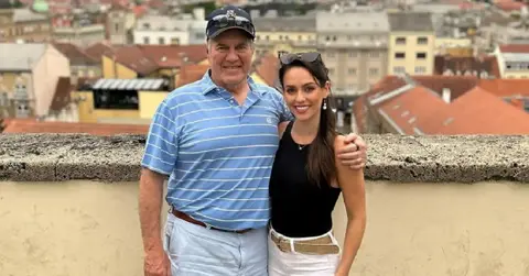 Photo of Bill Belichick and Jordan Hudson.