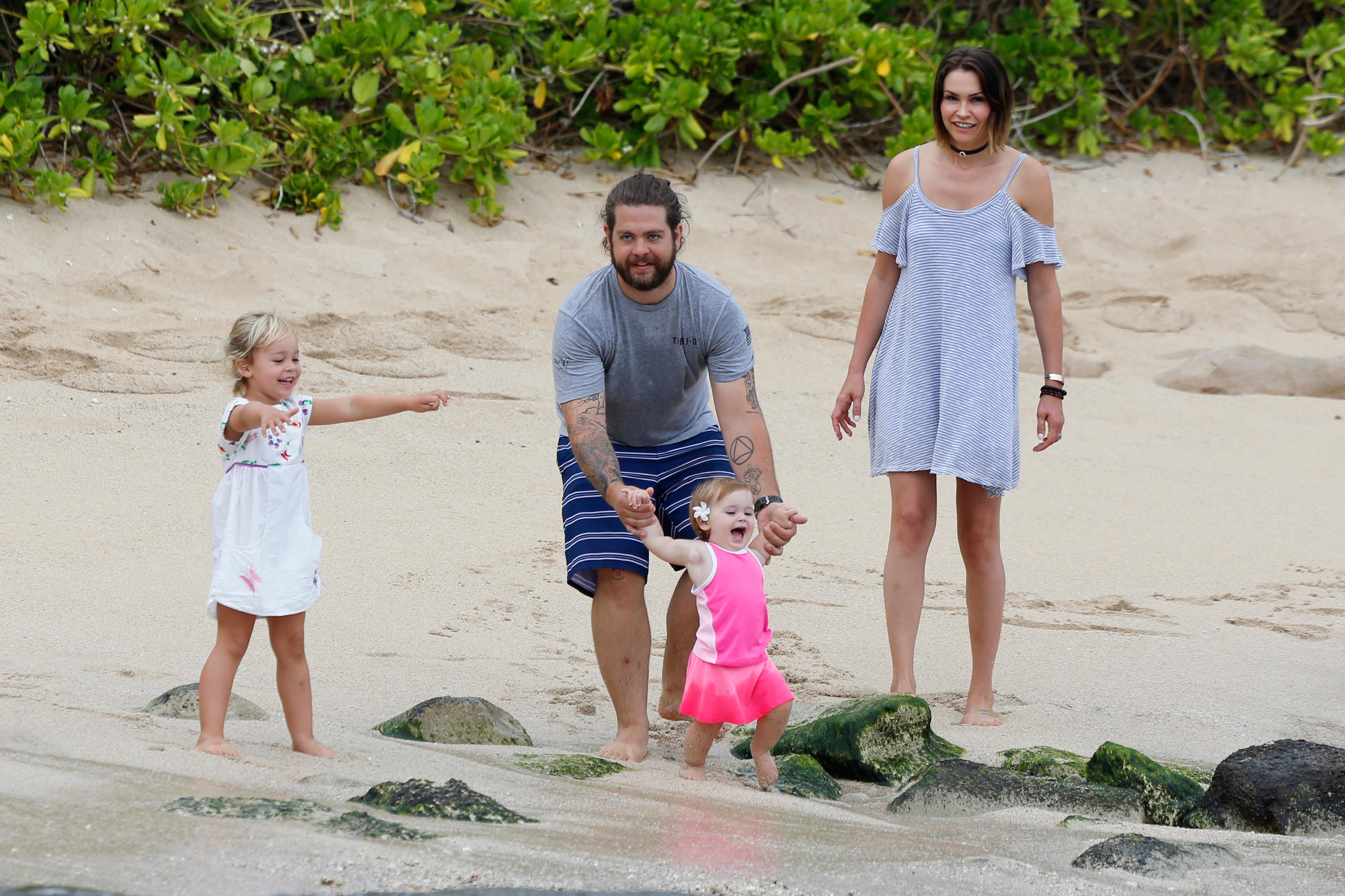 EXCLUSIVE: jack osbourne takes to the beach in Hawaii with his wife Lisa and children Pearl and Andy Rose