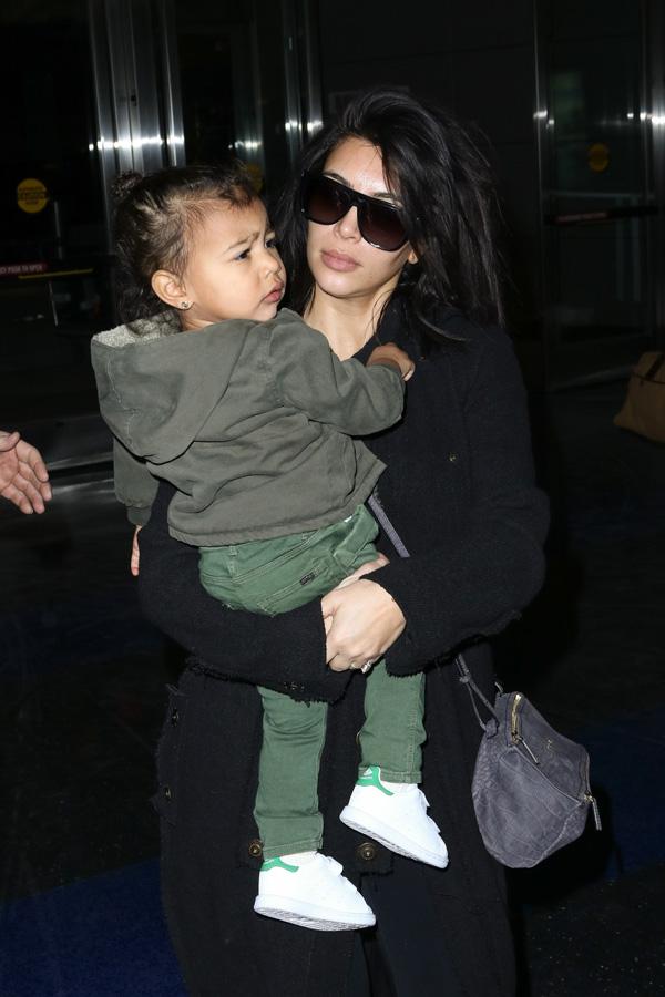 Kim Kardashian, Kanye and baby Nori are spotted at JFK airport