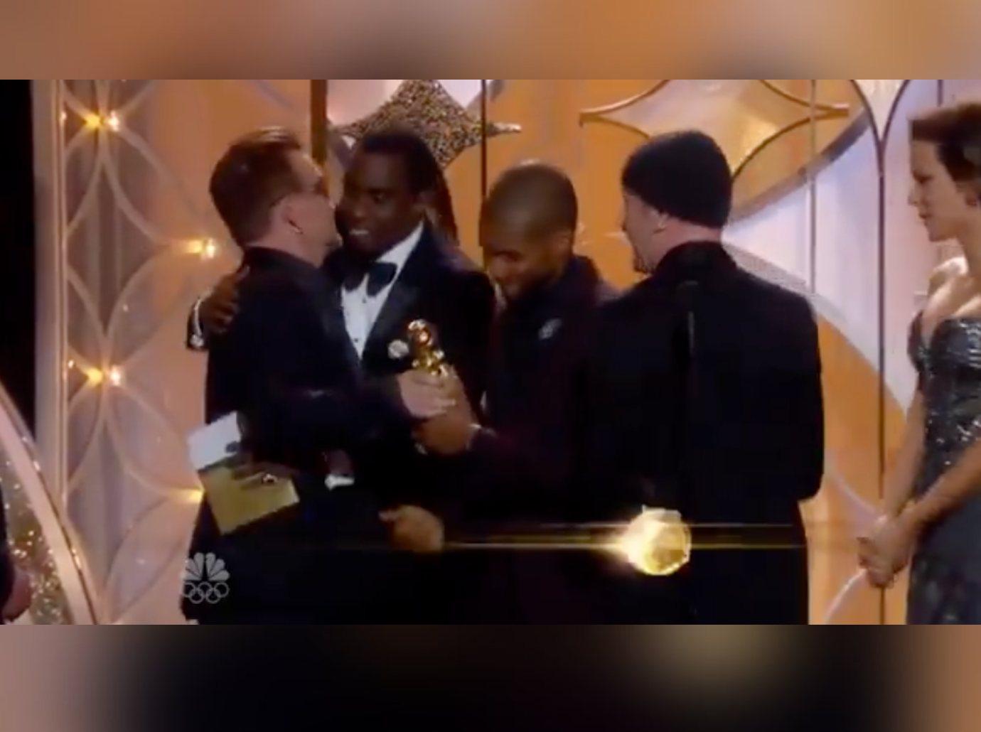 bono awkward moment sean diddy combs hug  golden globes watch