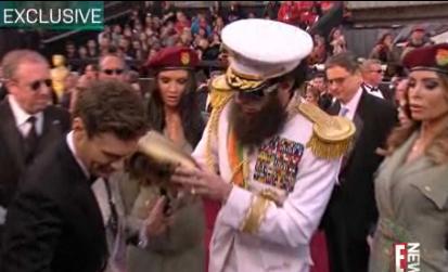 Sacha baron cohen ryan seacrest feb27nea.jpg