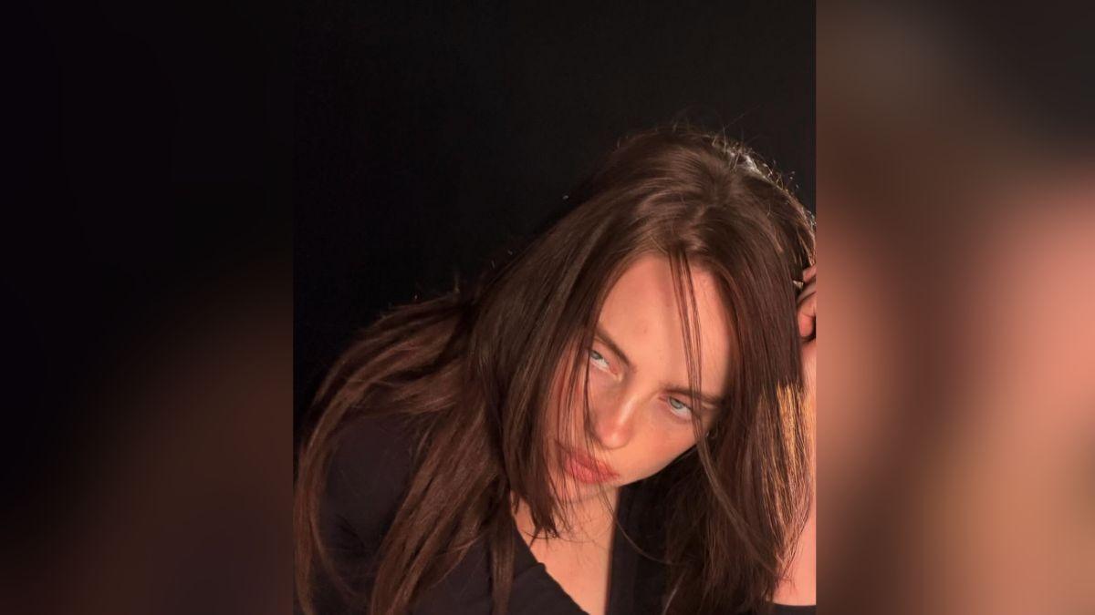 Image of Billie Eilish rocked a rare low-cut top in a new snap.