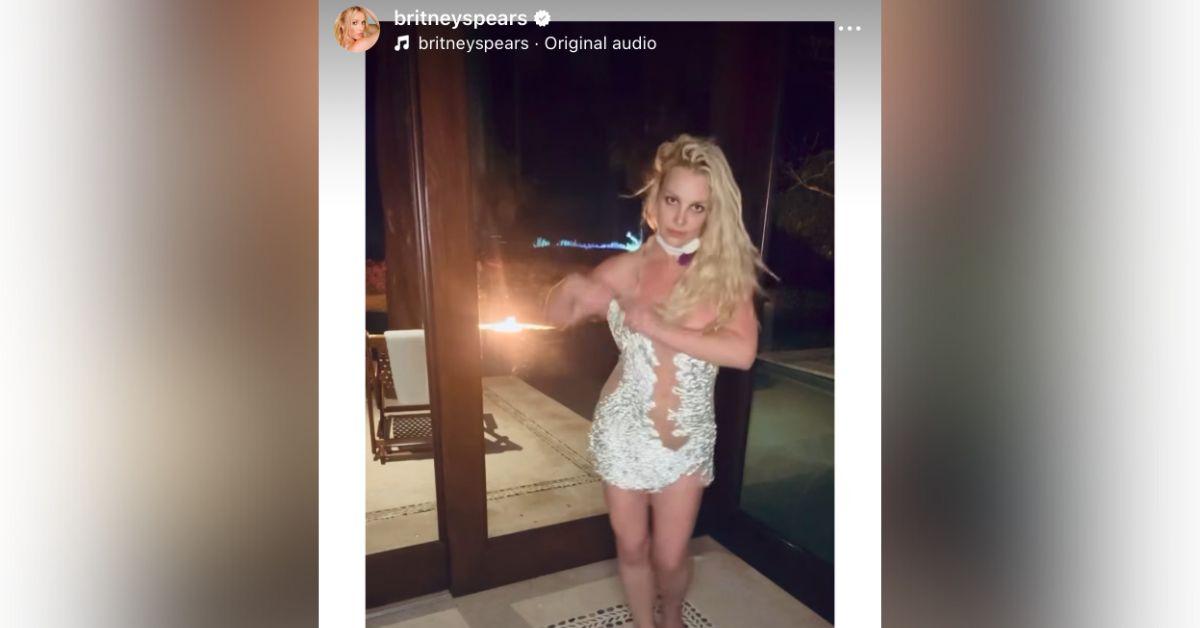 britney spears presses her cleavage together provocative video photos
