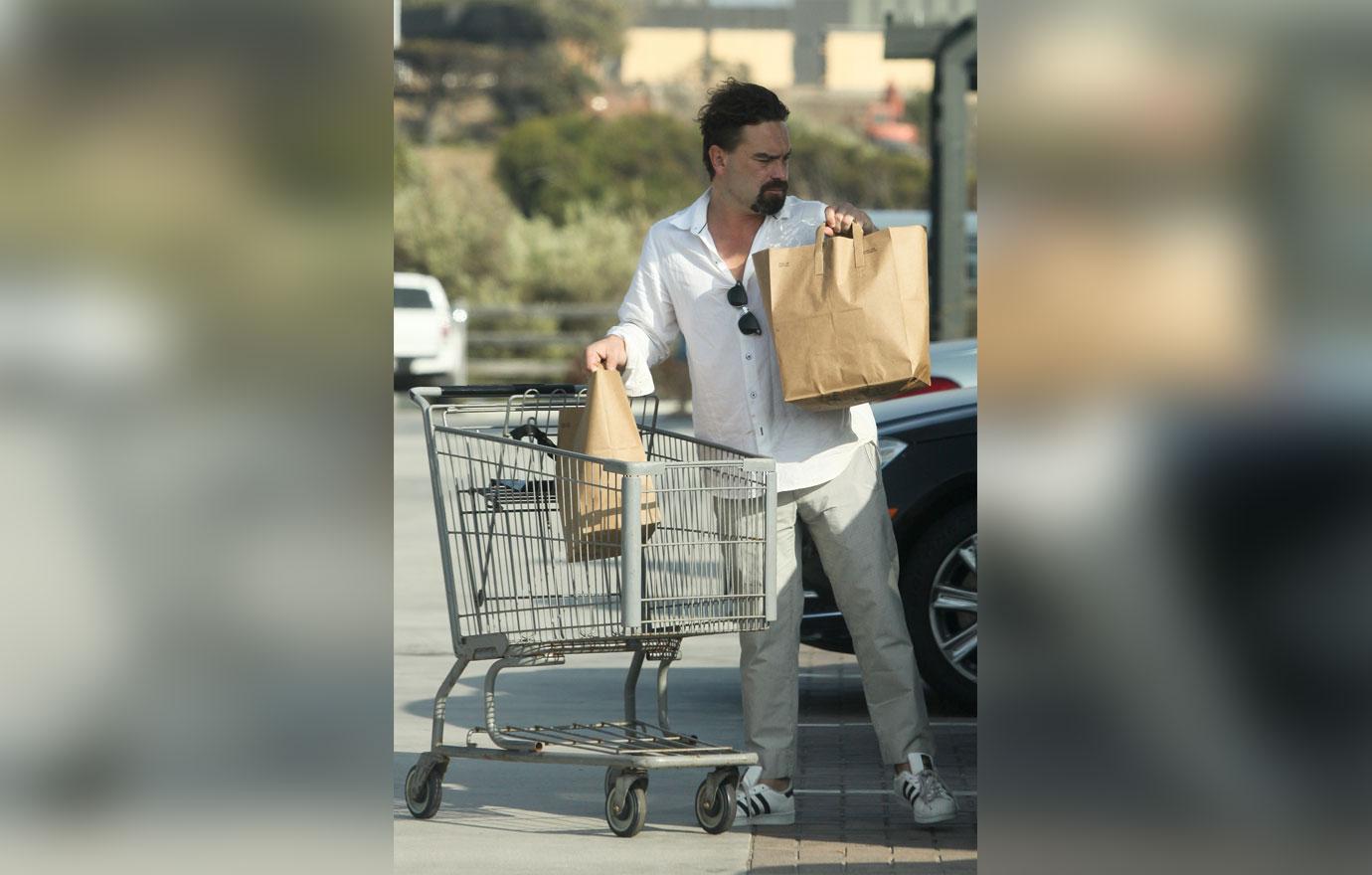 EXCLUSIVE: Johnny Galecki has a new look and goatee while grocery shopping in Malibu, CA