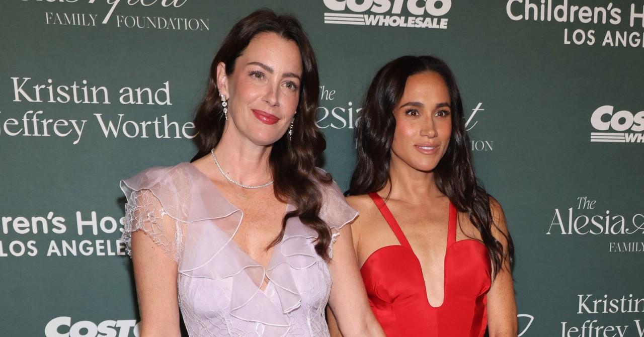 meghan markle stuns plunging red dress during surprise appearance childrens hospital la gala