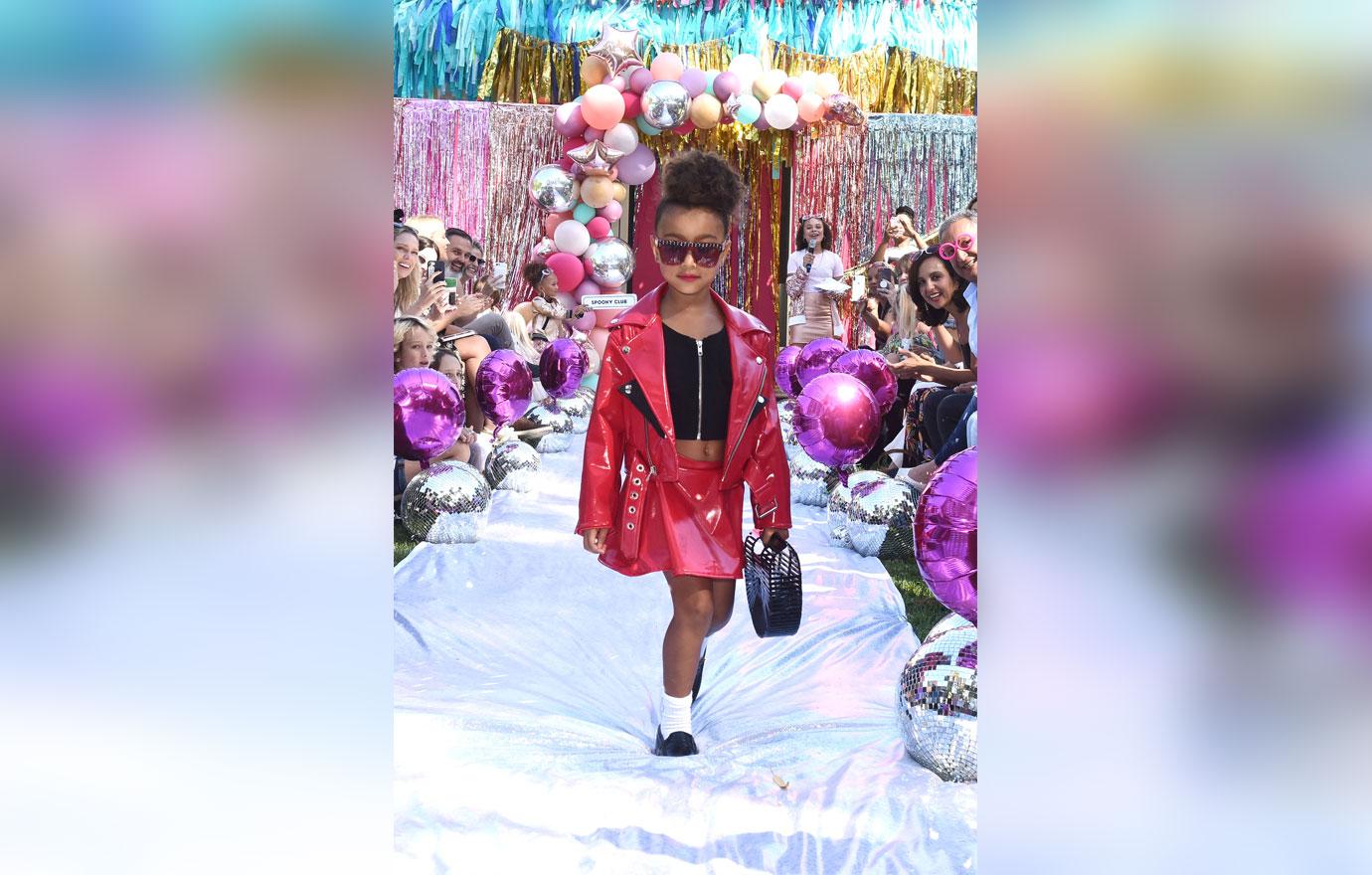 North West Wearing Red Skirt Set And Walking The Runway north west ultimate fashionista