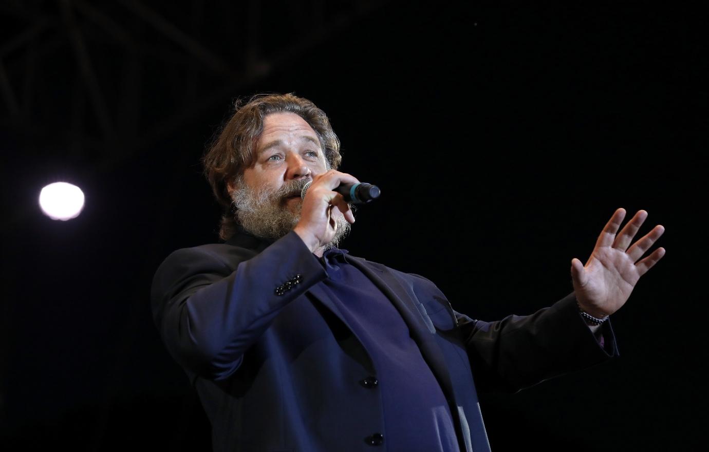 Russell Crowe speaks to the audience at a charity event in Rome, Italy in 2018