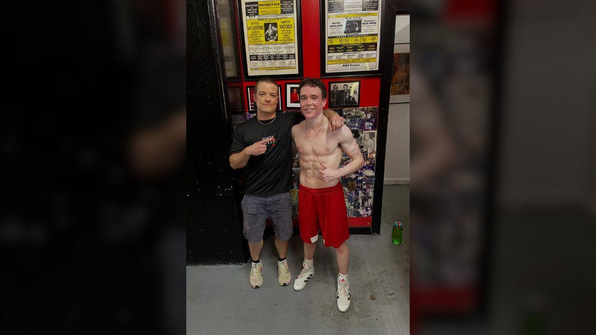 Photo of Elliot Page posed next to his coach, calling training an 'essential' part of his life.
