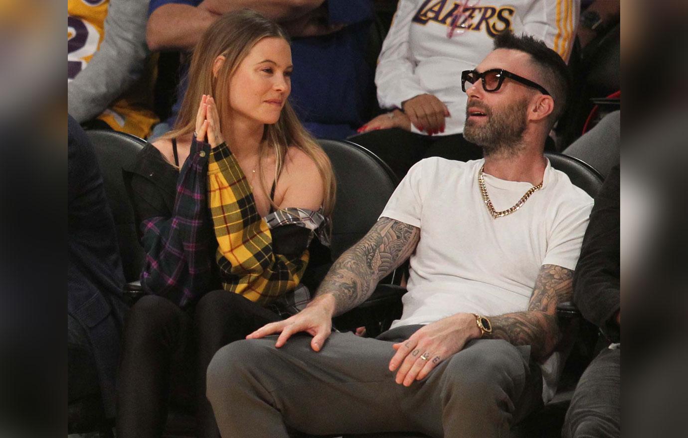 Adam Levine and Behati Prinsloo watch the Los Angeles Lakers play the Houston Rockets