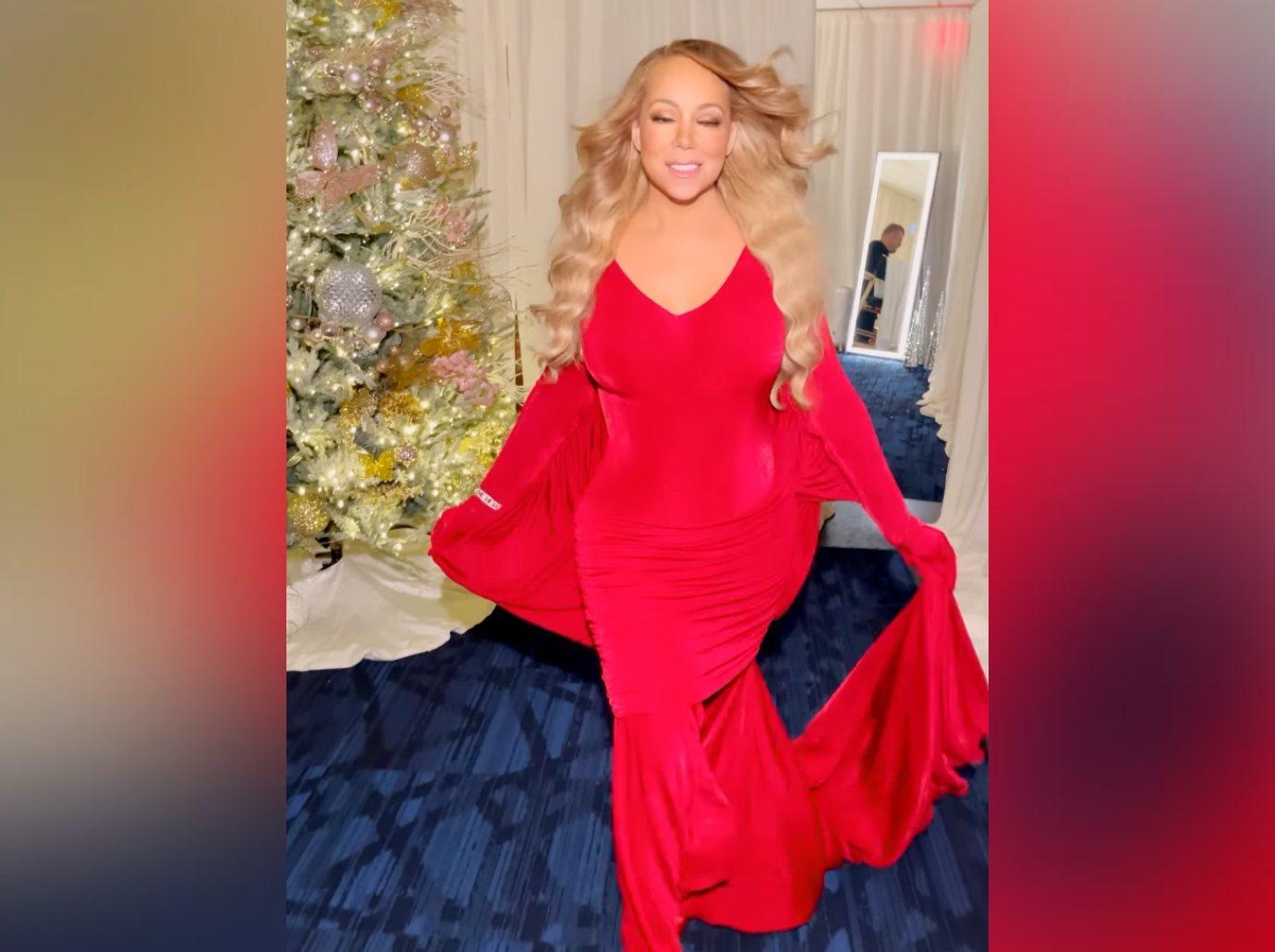 mariah carey shows off figure red gown christmas season watch