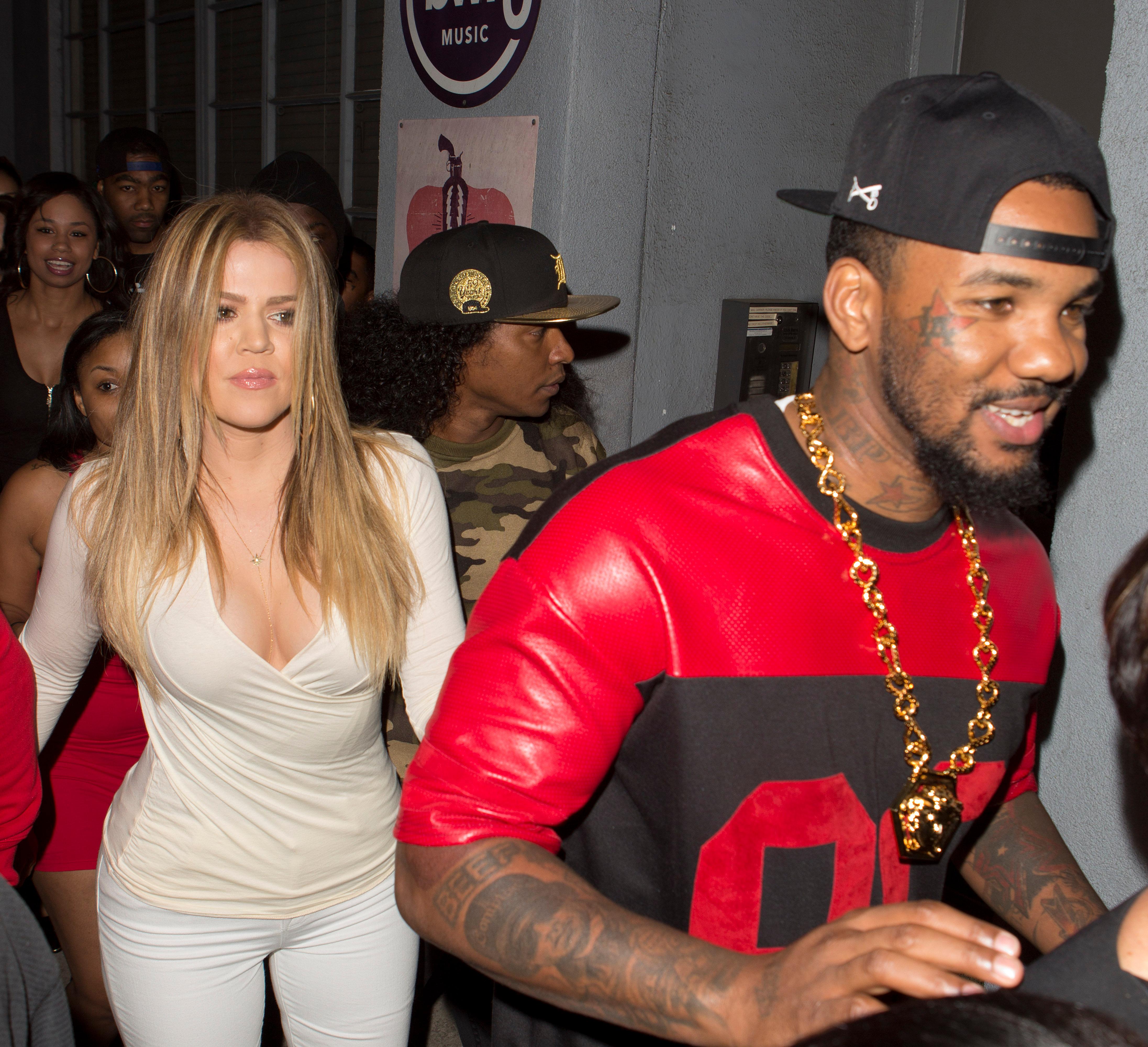 Khloe Kardashian holds hands with rapper The Game as they take mother Kris Jenner to Tru Night club in Hollywood, CA