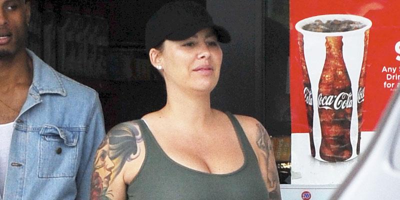 Pregnant Amber Rose Hides Natural Dark Hair Under Baseball Cap