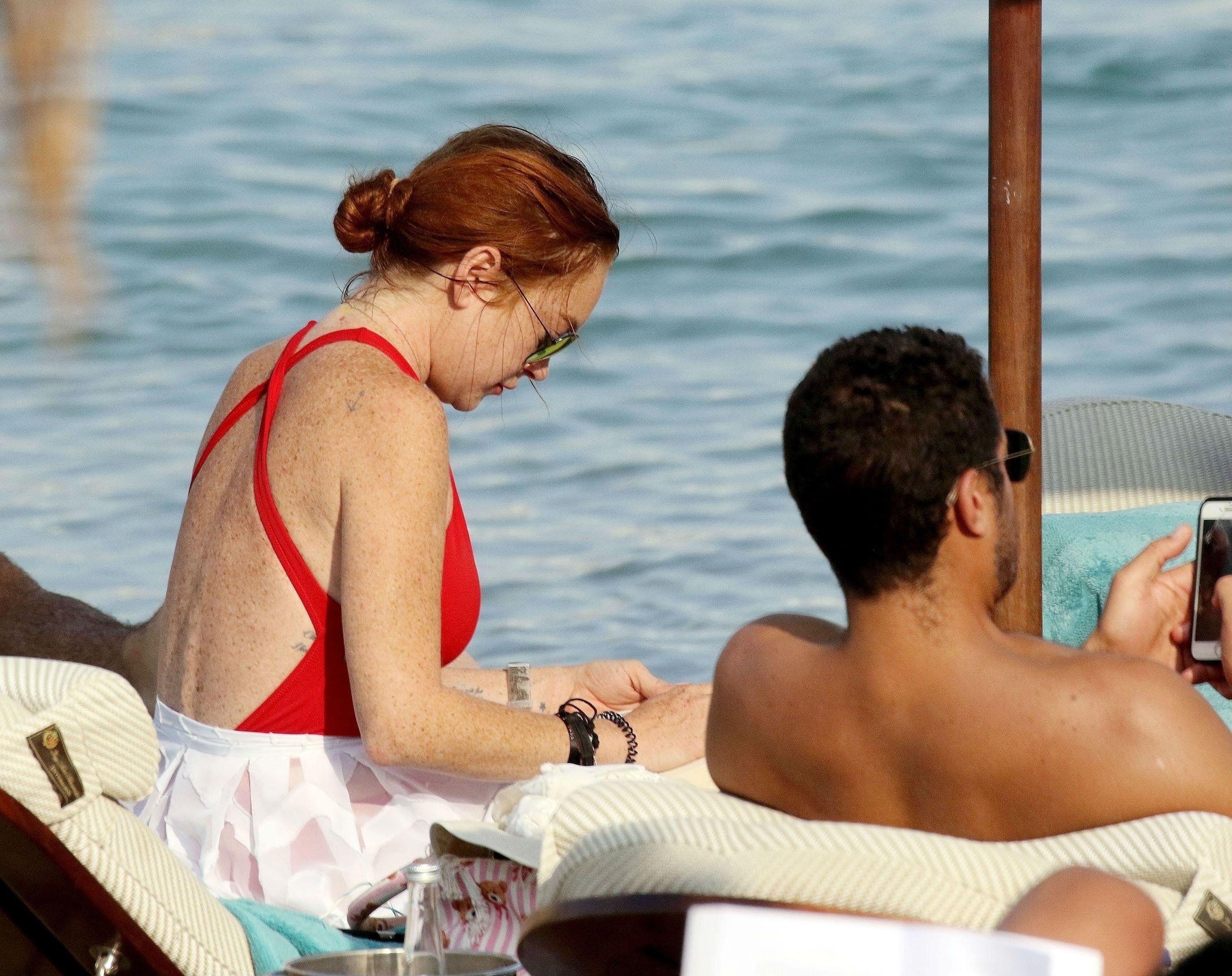 Lindsay Lohan Vacations In Mykonos In Red Swims3uit Photos