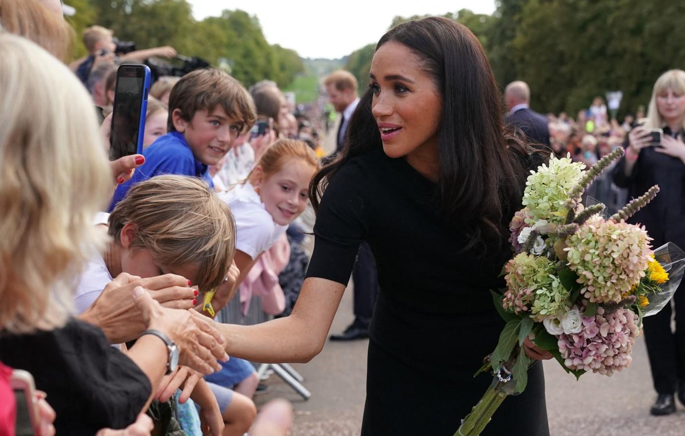 Meghan Markle wears coat, cashmere shawl in 70-degree California